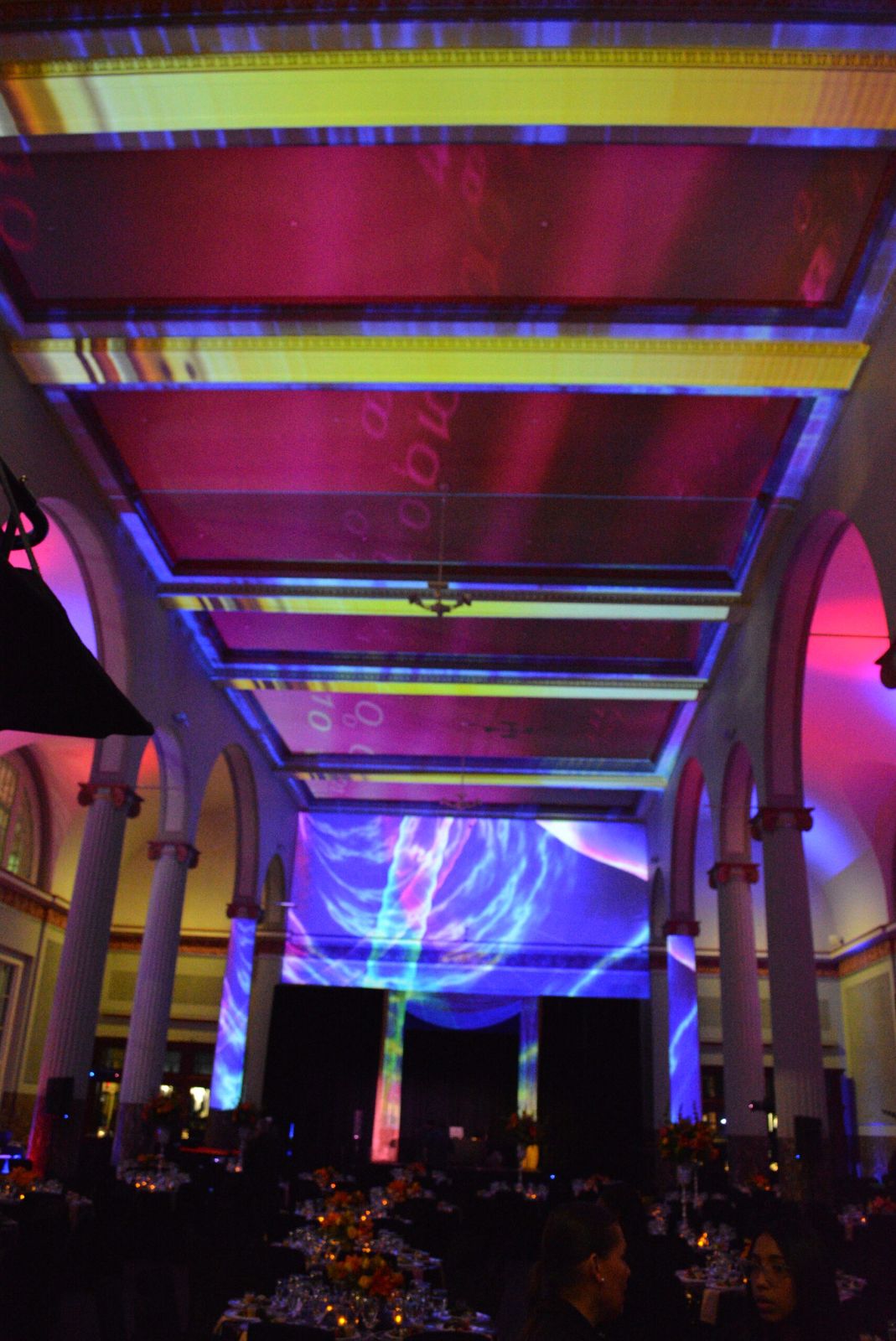Guests seated at dinner under projection-mapped coffered ceiling bays and a large back-wall image at Historic Union Station, Lance McCullers Jr. Foundation sneaker gala